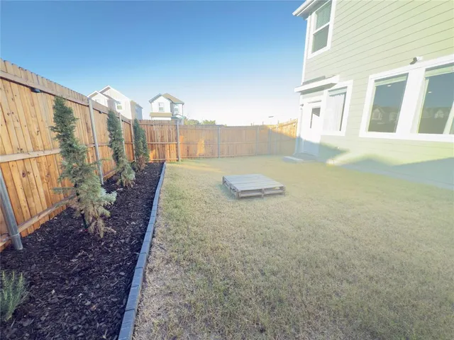 a view of a house with backyard of water and mountain view