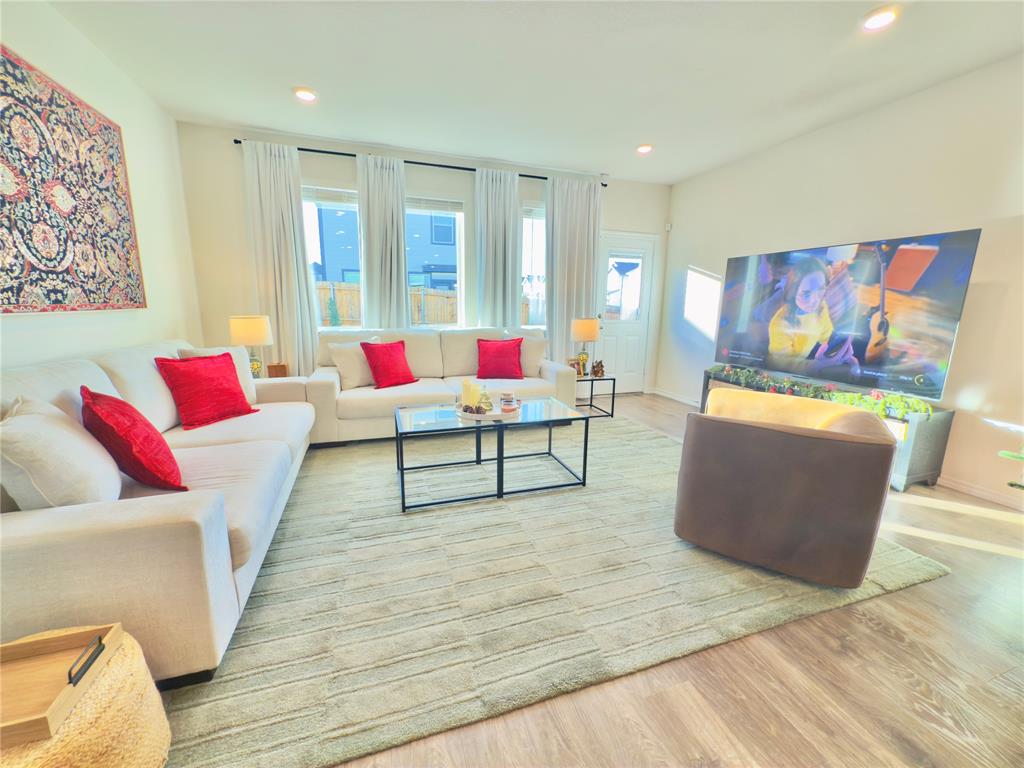 6000 Holly Spg Road Princeton, TX 75407 - Photo 5 of 27 a living room with furniture and a wooden floor