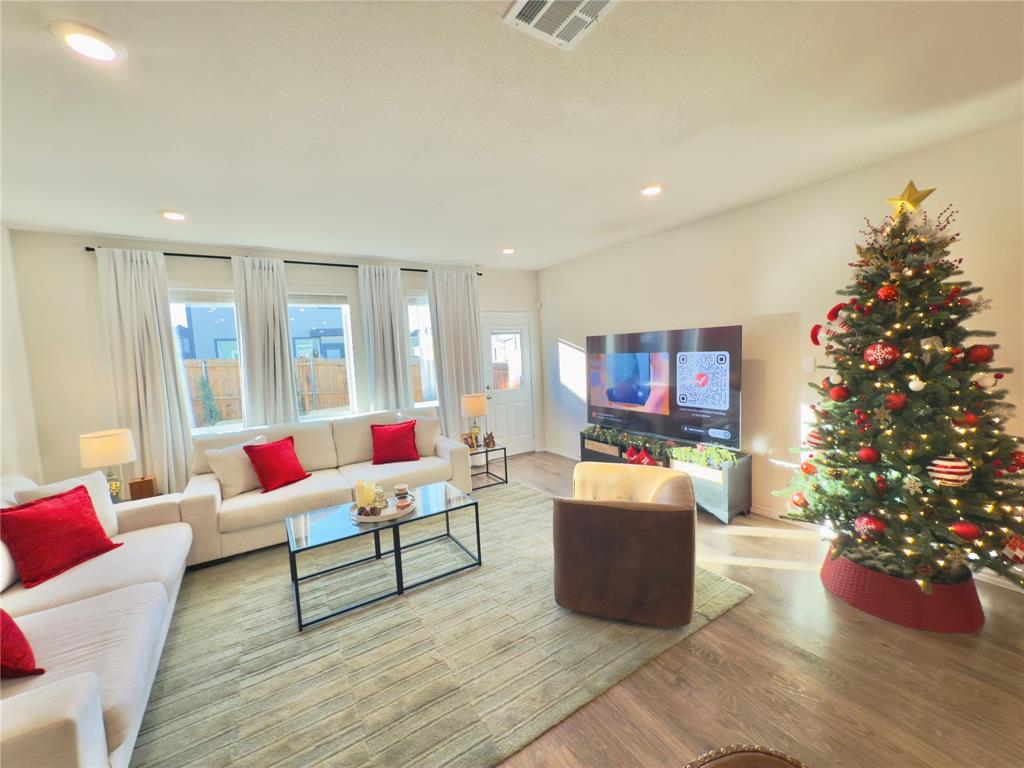6000 Holly Spg Road Princeton, TX 75407 - Photo 6 of 27 a living room with furniture and a potted plant