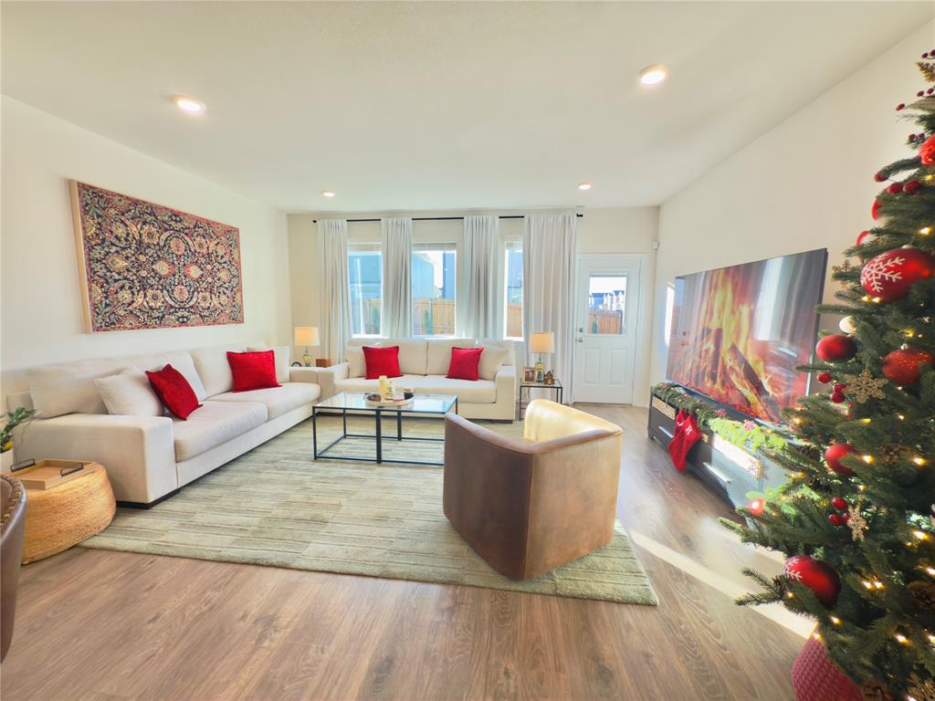 6000 Holly Spg Road Princeton, TX 75407 - Photo 7 of 27 a living room filled with furniture and a floor to ceiling window