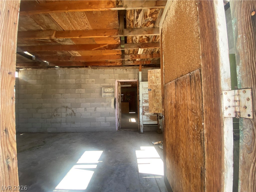 701 3rd Street Gabbs, NV 89409 - Photo 9 of 10 Concrete floors and exposed wood beams define this practical storage space.
