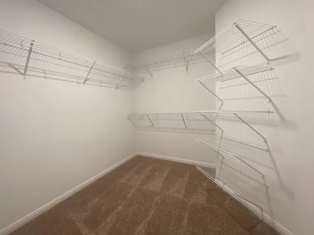 a view of a room with racks on the wall