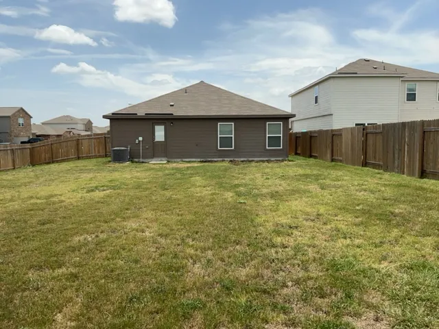 a house with yard in front of it
