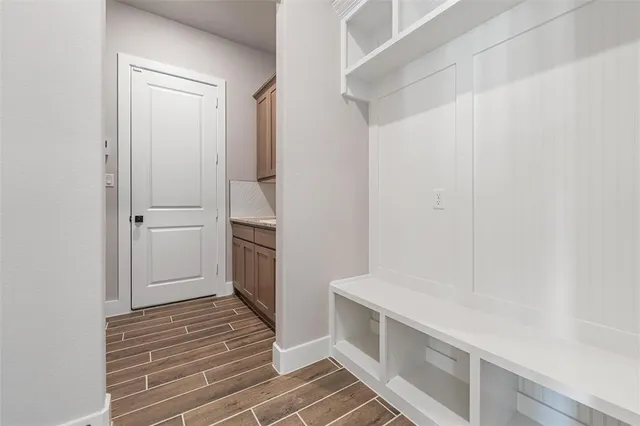 a bathroom with a shower and a sink