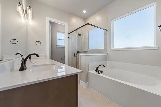 a bathroom with a bathtub and a sink