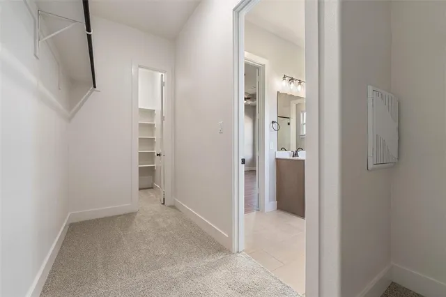 a view of a hallway with closet and entryway