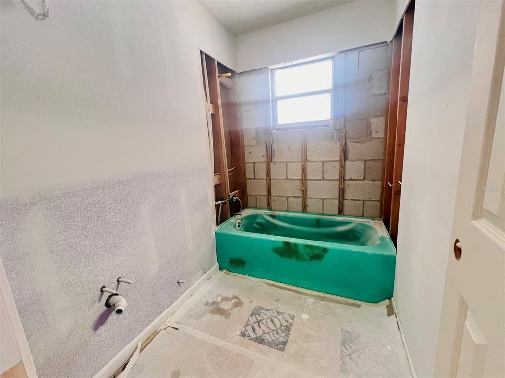 1977 Beach Road, Unit 21 Englewood, FL 34223 - Photo 13 of 27 a bathroom with a sink and a mirror