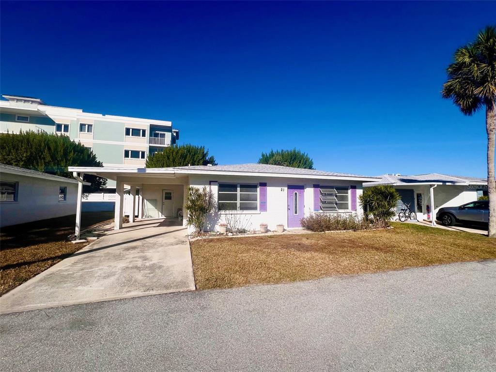 1977 Beach Road, Unit 21 Englewood, FL 34223 - Photo 17 of 27 a view of a house with a patio