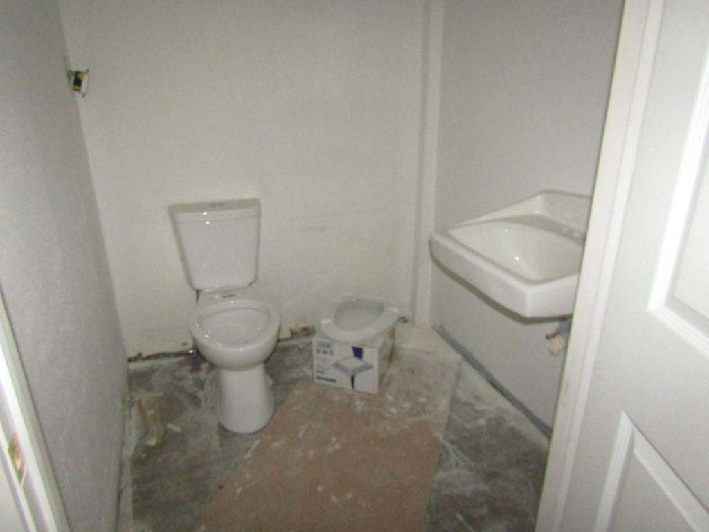 407-409 West 8th Avenue Homestead, PA 15120 - Photo 11 of 36 a bathroom with a sink and a toilet