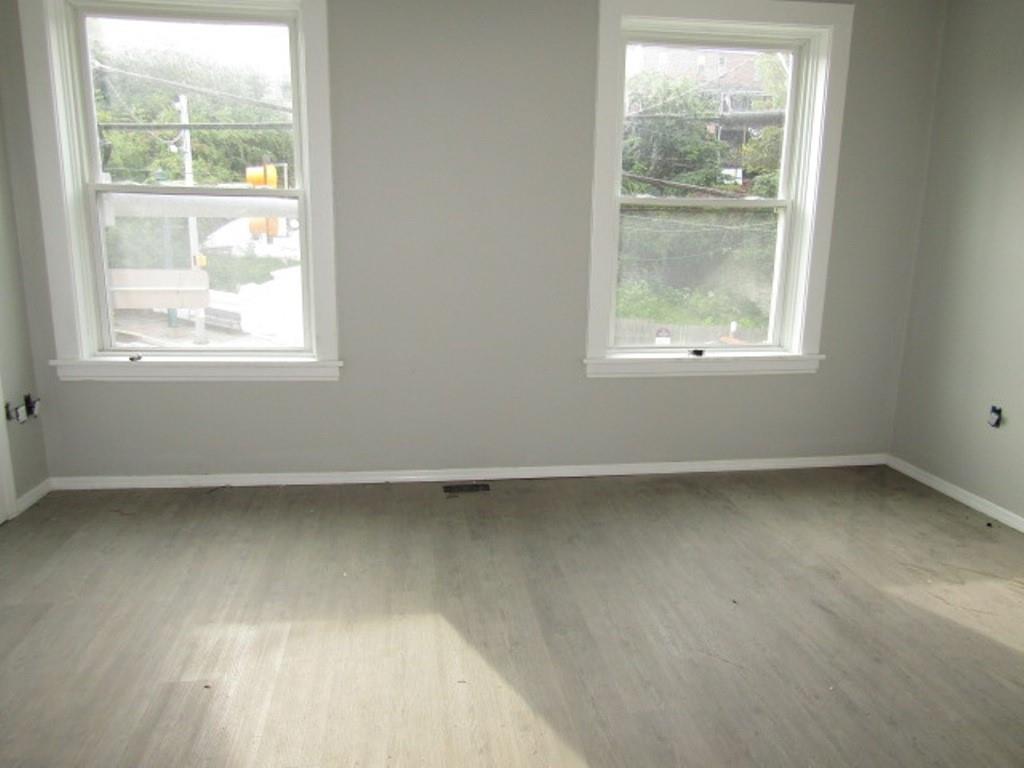 407-409 West 8th Avenue Homestead, PA 15120 - Photo 17 of 36 an empty room with a window