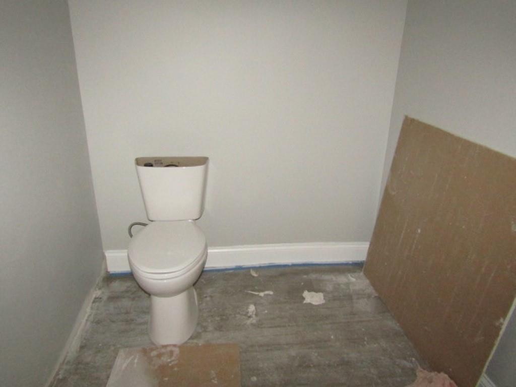 407-409 West 8th Avenue Homestead, PA 15120 - Photo 5 of 36 a bathroom with a toilet and a sink