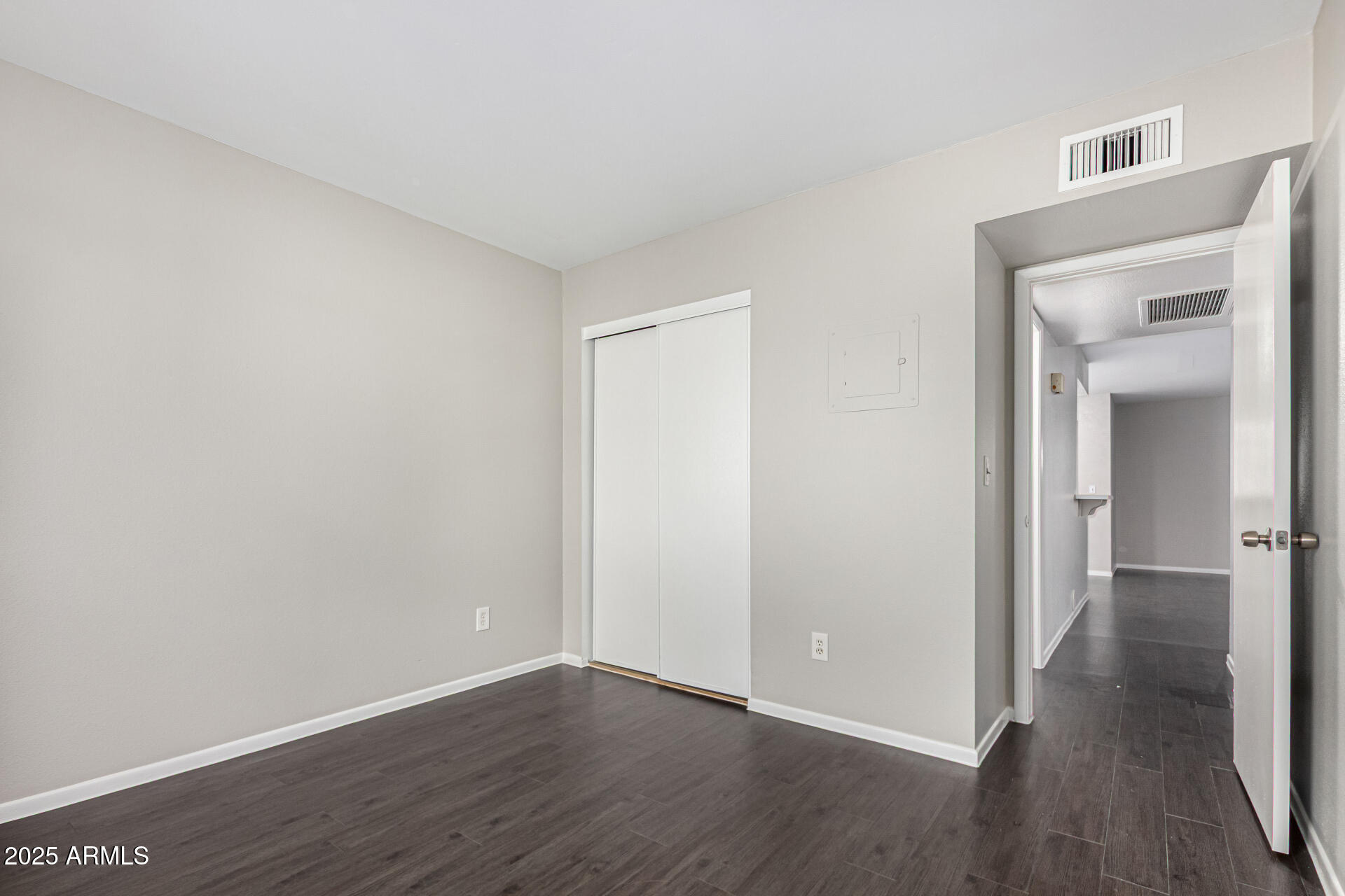 2133 West Turney Avenue, Unit D76 Phoenix, AZ 85015 - Photo 12 of 28 a view of a room with wooden floor