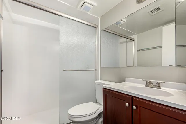 a bathroom with a sink toilet and vanity