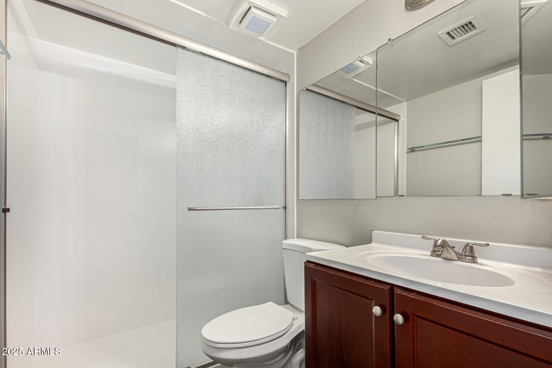 2133 West Turney Avenue, Unit D76 Phoenix, AZ 85015 - Photo 18 of 28 a bathroom with a sink toilet and vanity