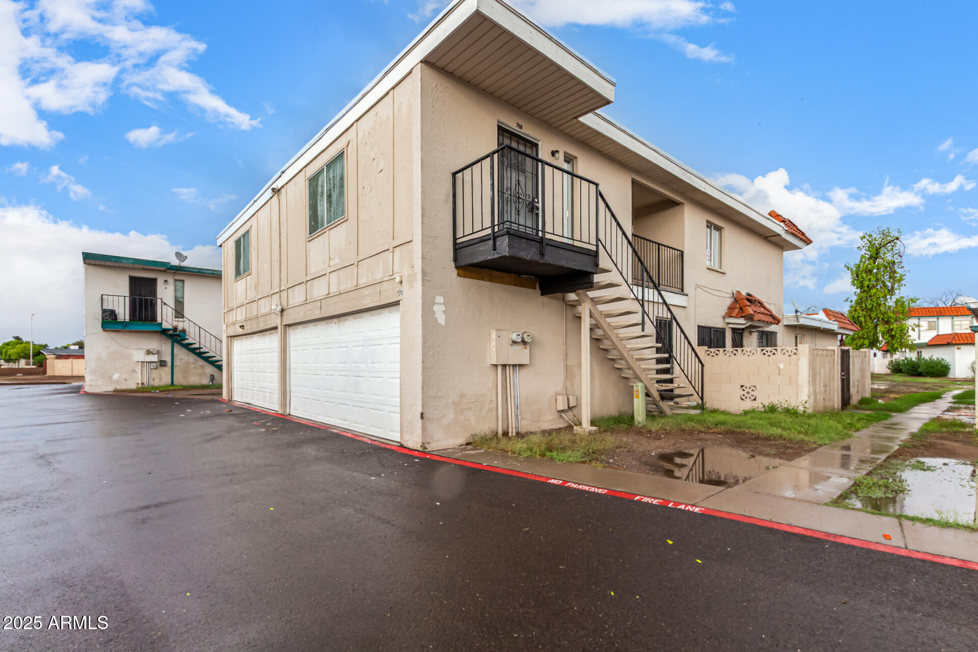 2133 West Turney Avenue, Unit D76 Phoenix, AZ 85015 - Photo 23 of 28 a view of a house with a street