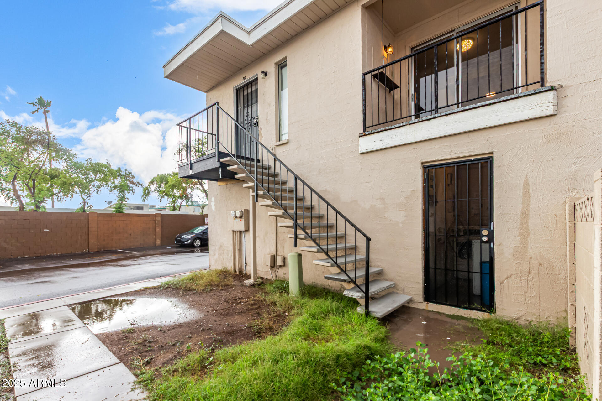 2133 West Turney Avenue, Unit D76 Phoenix, AZ 85015 - Photo 26 of 28 a view of a house with wooden stairs