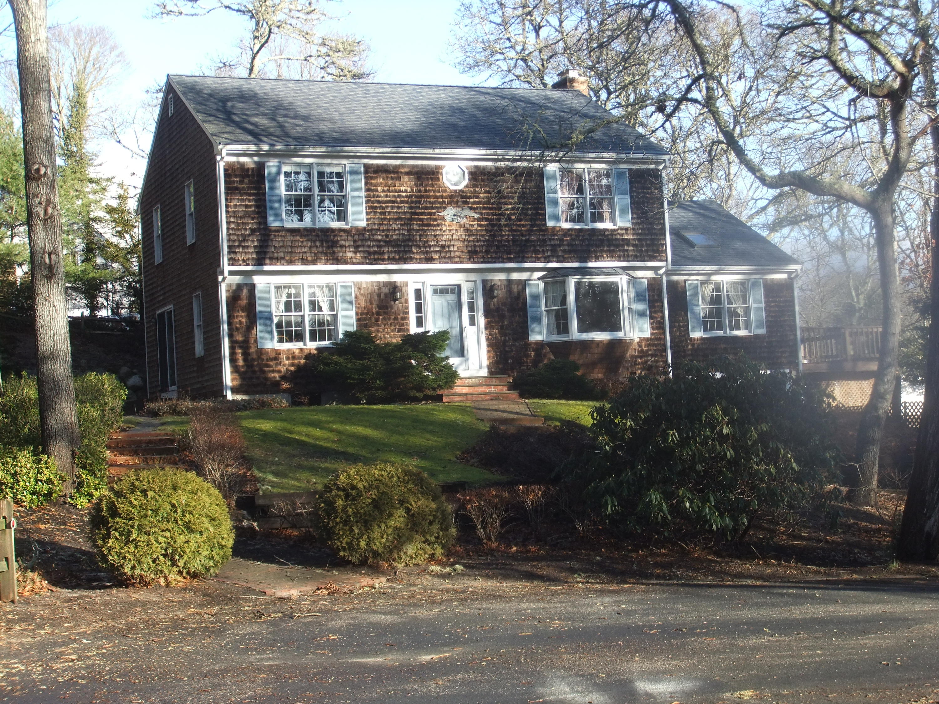 33 Ridgewood Road Orleans, MA 02653 - Photo 4 of 35 front view of house with a yard