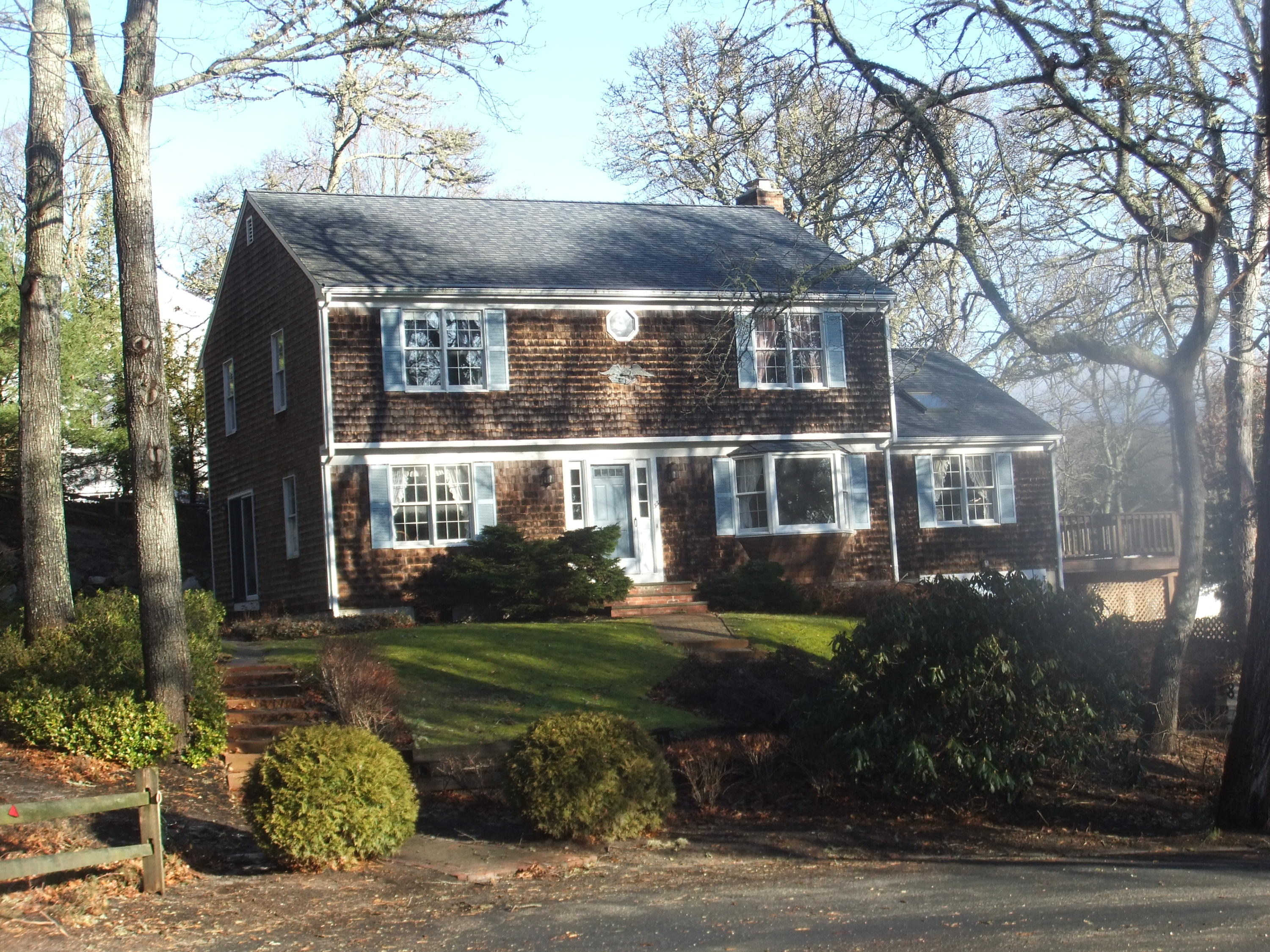 33 Ridgewood Road Orleans, MA 02653 - Photo 5 of 35 a front view of a house with a garden