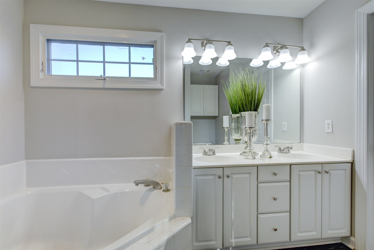 7220 Ridgeline Drive Raleigh, NC 27613 - Photo 9 of 16 Dual Vanities, Garden Tub, separate shower and lots of natural light are great features of the master bath. There's also a huge walk-in closet. 2nd floor Master Bath