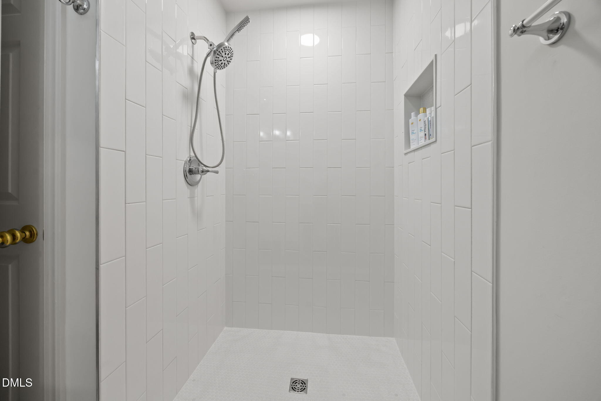 562 Weathergreen Drive Raleigh, NC 27615 - Photo 21 of 47 a bathroom with a glass shower door