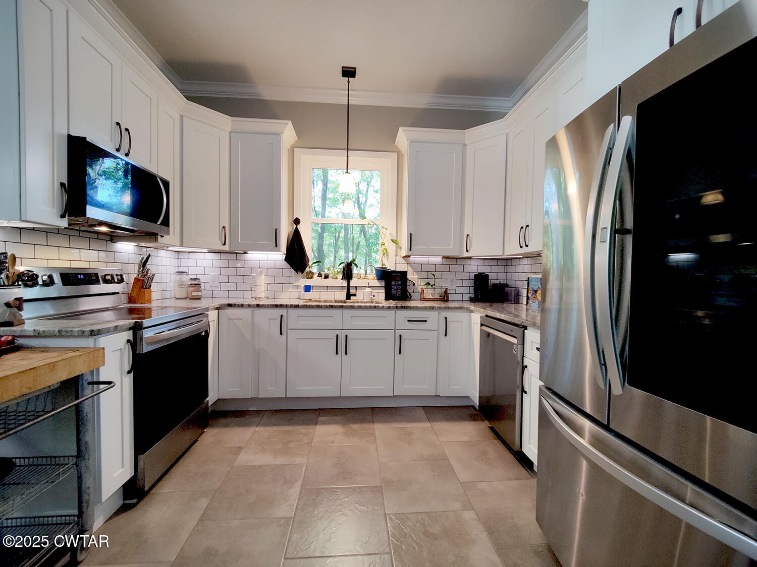 1620 Brooks Road Atwood, TN 38220 - Photo 11 of 34 a kitchen with a sink stainless steel appliances and white cabinets