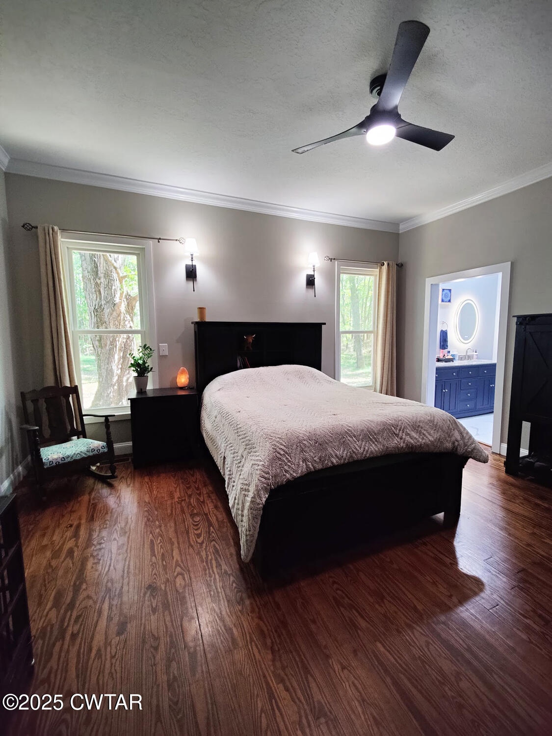 1620 Brooks Road Atwood, TN 38220 - Photo 16 of 34 a large bedroom with a bed and wooden floor
