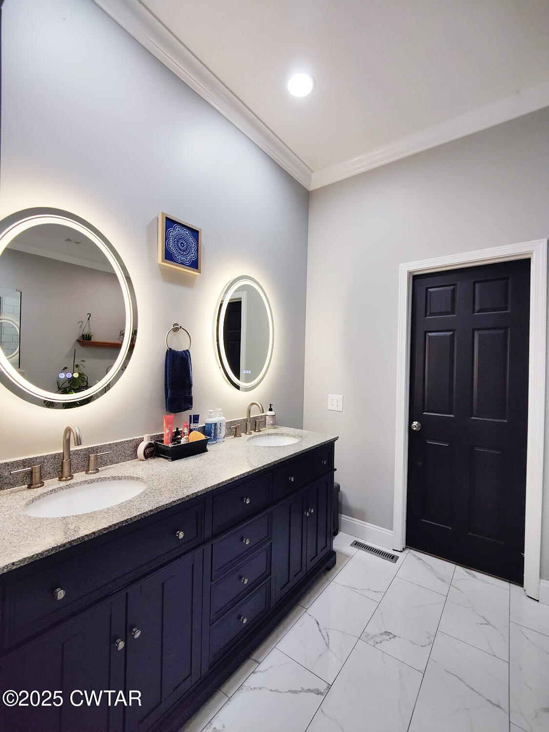 1620 Brooks Road Atwood, TN 38220 - Photo 18 of 34 a bathroom with a double vanity sink and a mirror