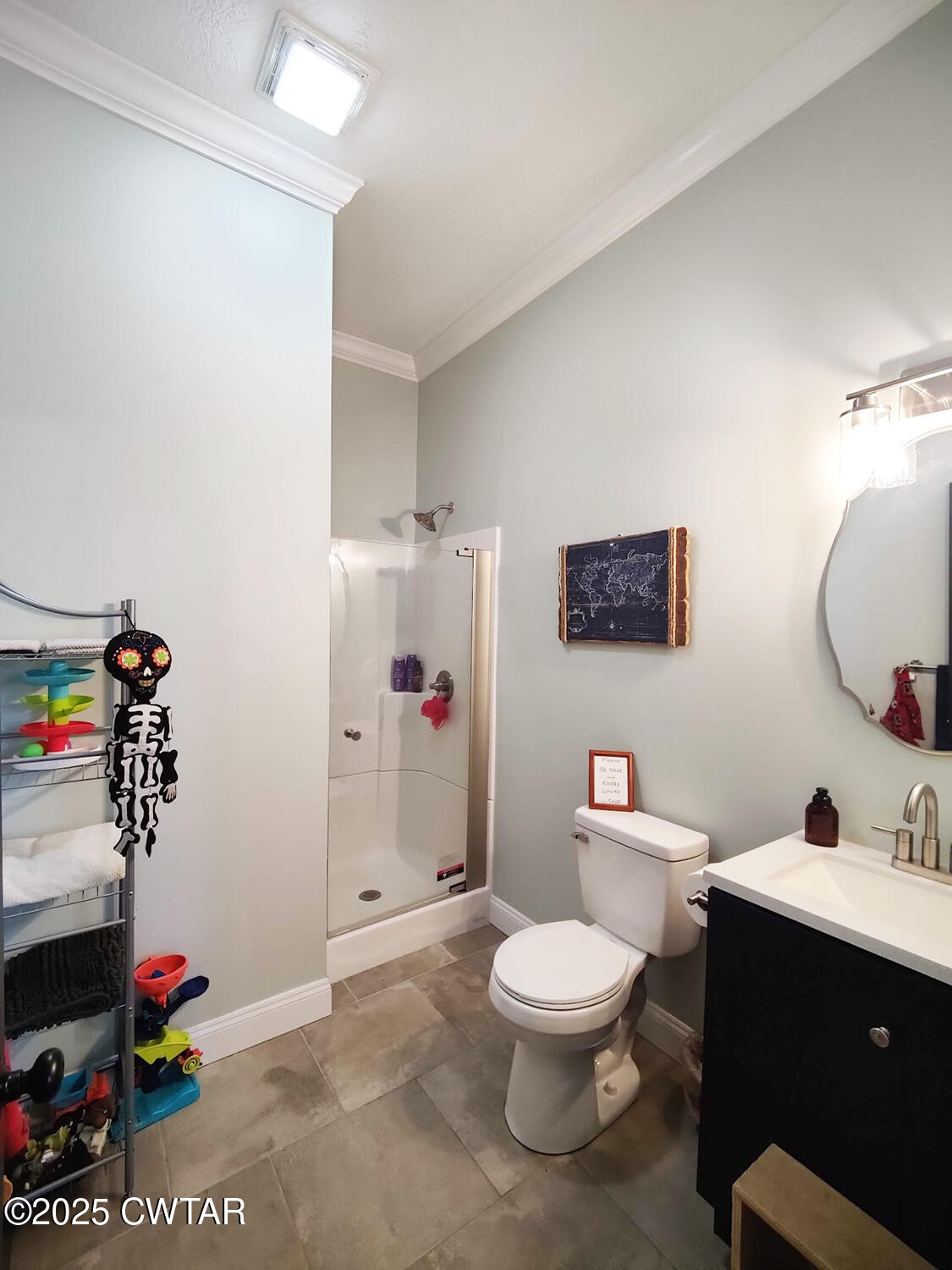 1620 Brooks Road Atwood, TN 38220 - Photo 24 of 34 a bathroom with a toilet sink vanity and mirror