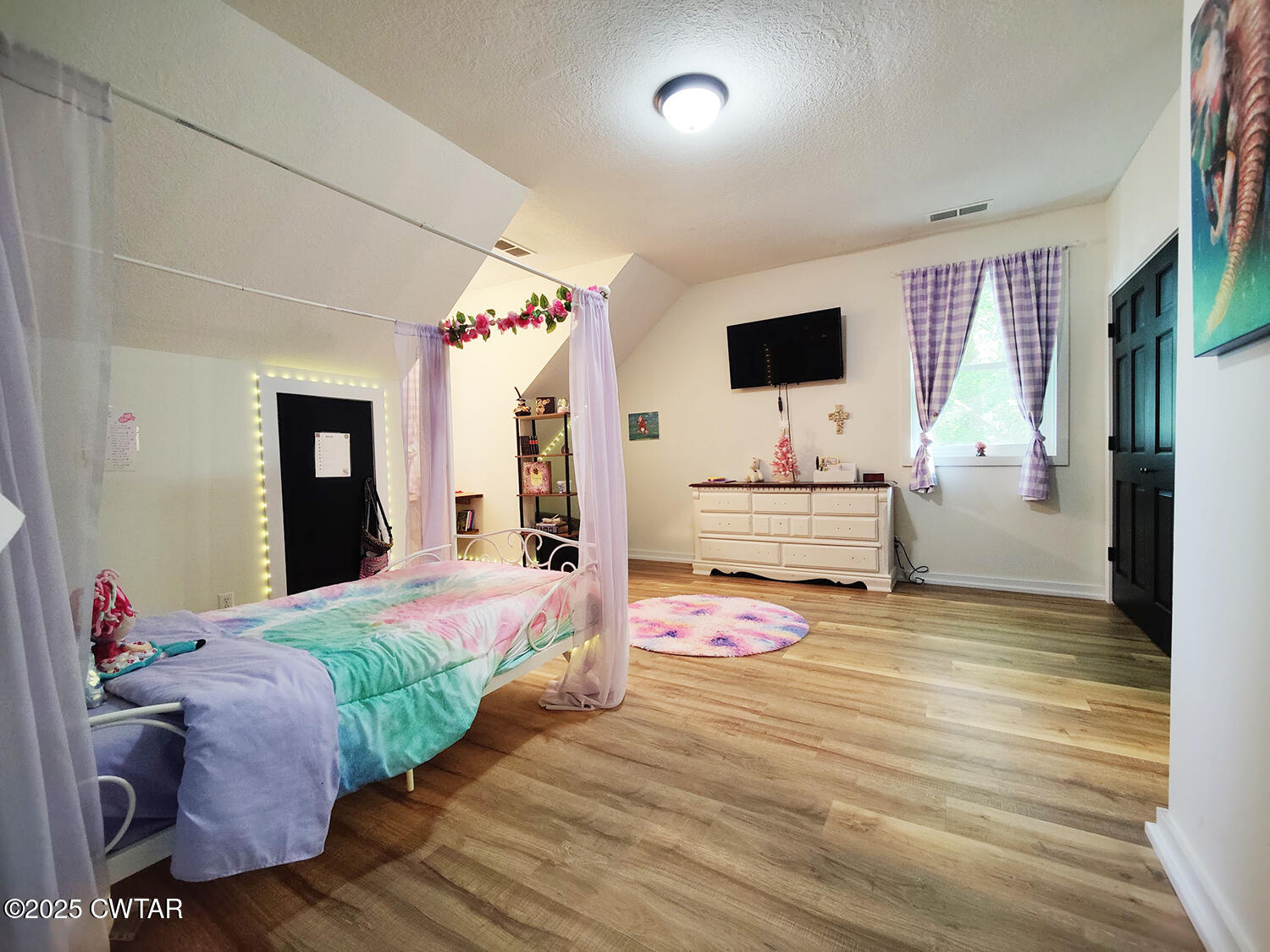 1620 Brooks Road Atwood, TN 38220 - Photo 29 of 34 a bedroom with a bed and a flat screen tv