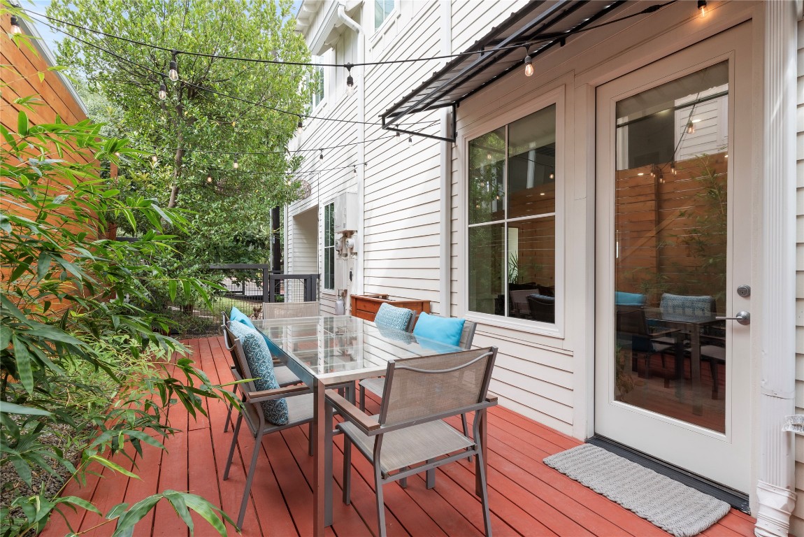 712 Cardinal Lane, Unit A Austin, TX 78704 - Photo 36 of 37 Side patio off kitchen perfect for grilling and chilling. Multiple seating areas to enjoy.