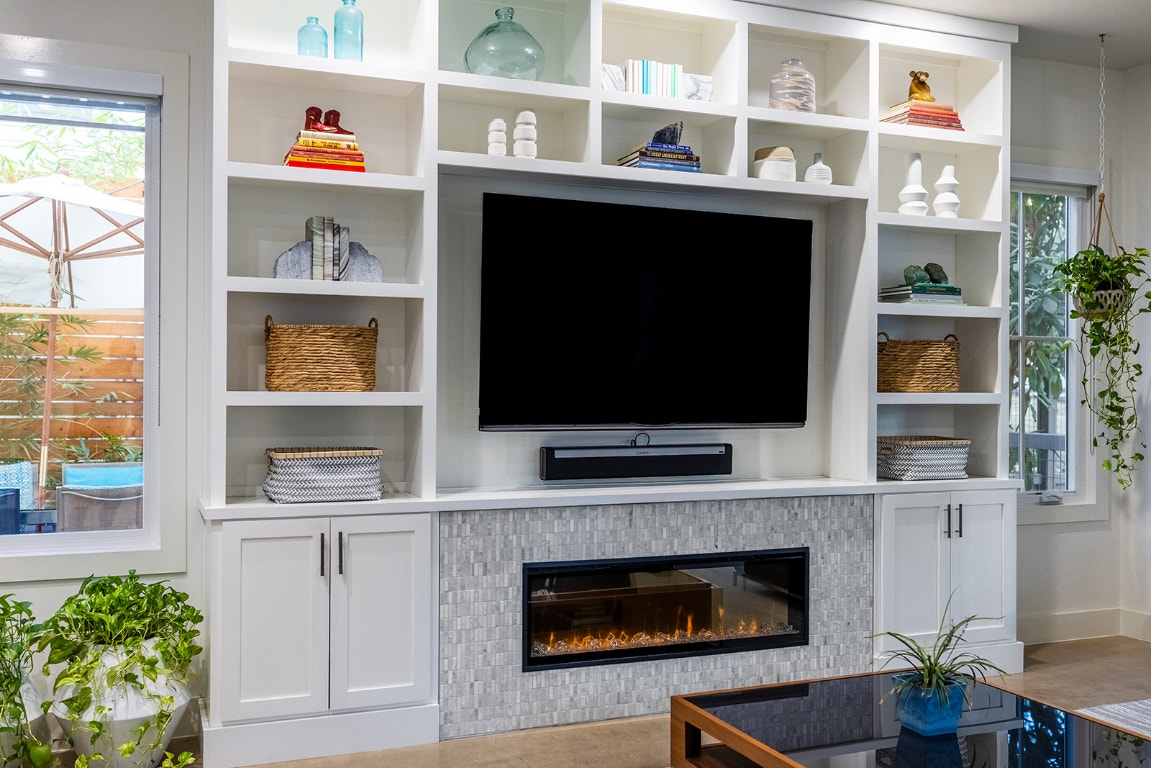 712 Cardinal Lane, Unit A Austin, TX 78704 - Photo 5 of 37 Bountiful built-ins perfect for books, art, etc. around cozy fireplace.