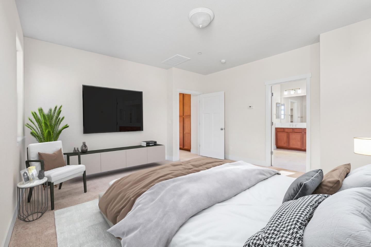 19134 Fallingwater Lane Marina, CA 93933 - Photo 16 of 32 a bedroom with a large bed and a flat screen tv