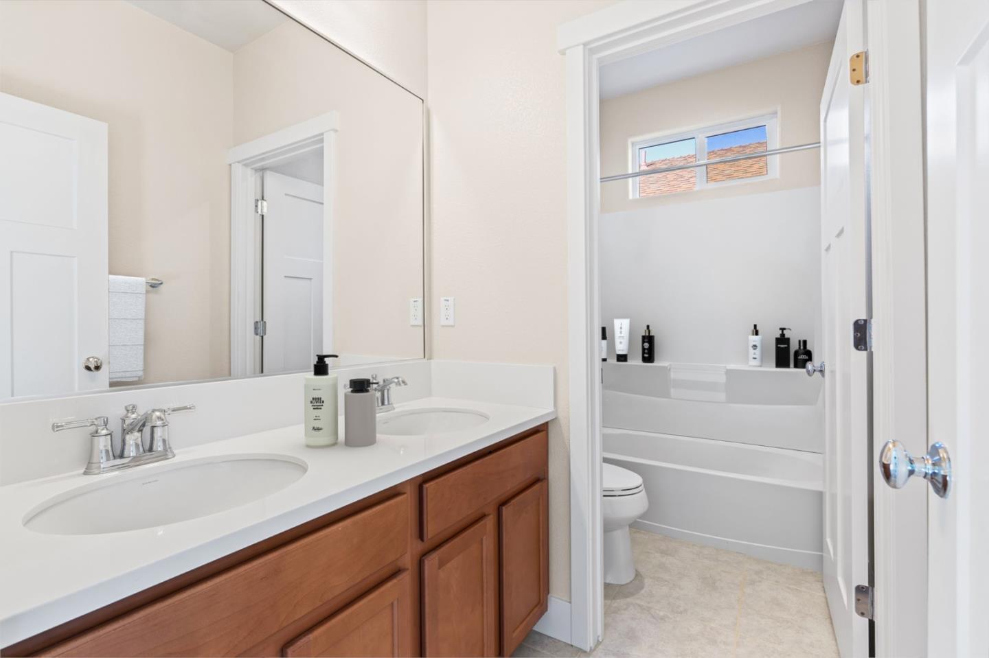 19134 Fallingwater Lane Marina, CA 93933 - Photo 19 of 32 a bathroom with a sink a toilet and shower