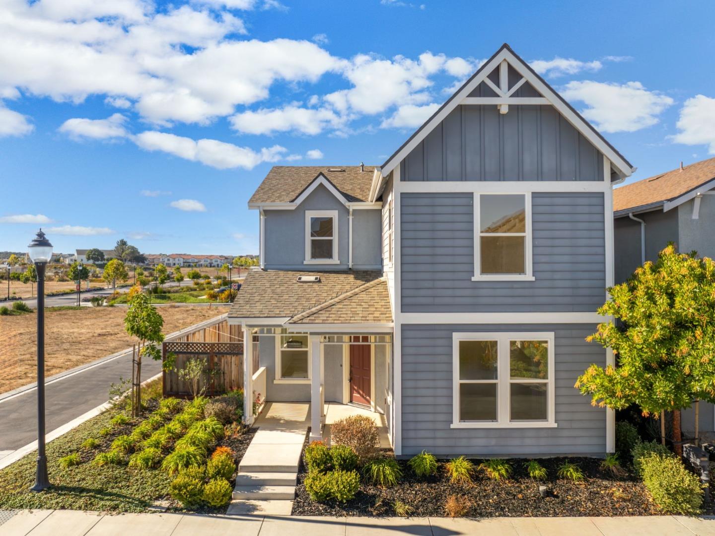 19134 Fallingwater Lane Marina, CA 93933 - Photo 2 of 32 a front view of a house with a yard