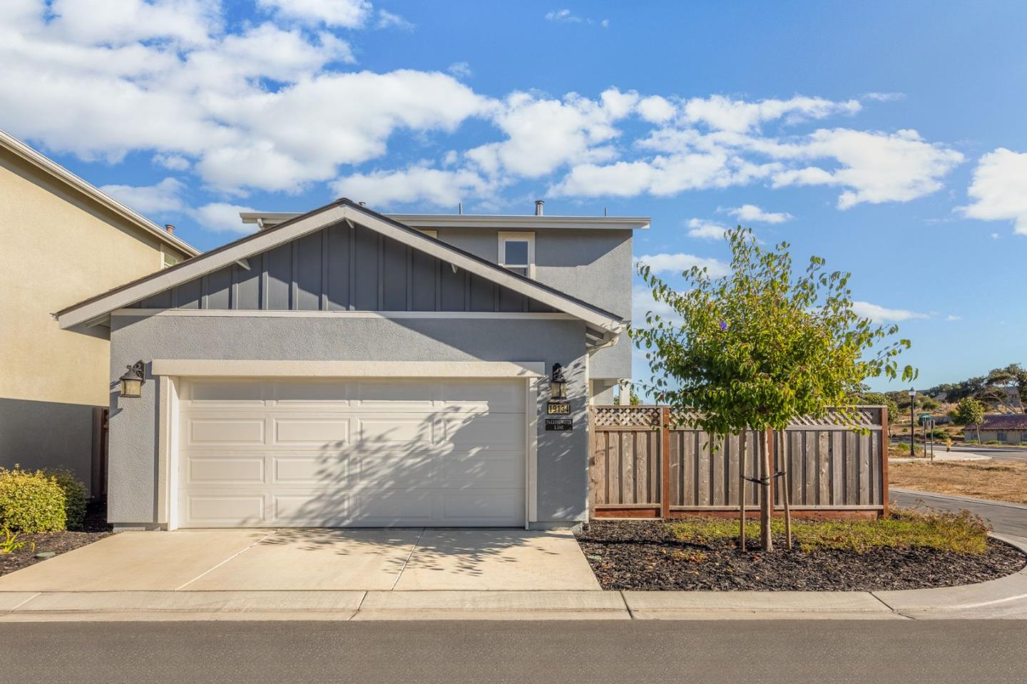 19134 Fallingwater Lane Marina, CA 93933 - Photo 25 of 32 a front view of a house with wooden fence