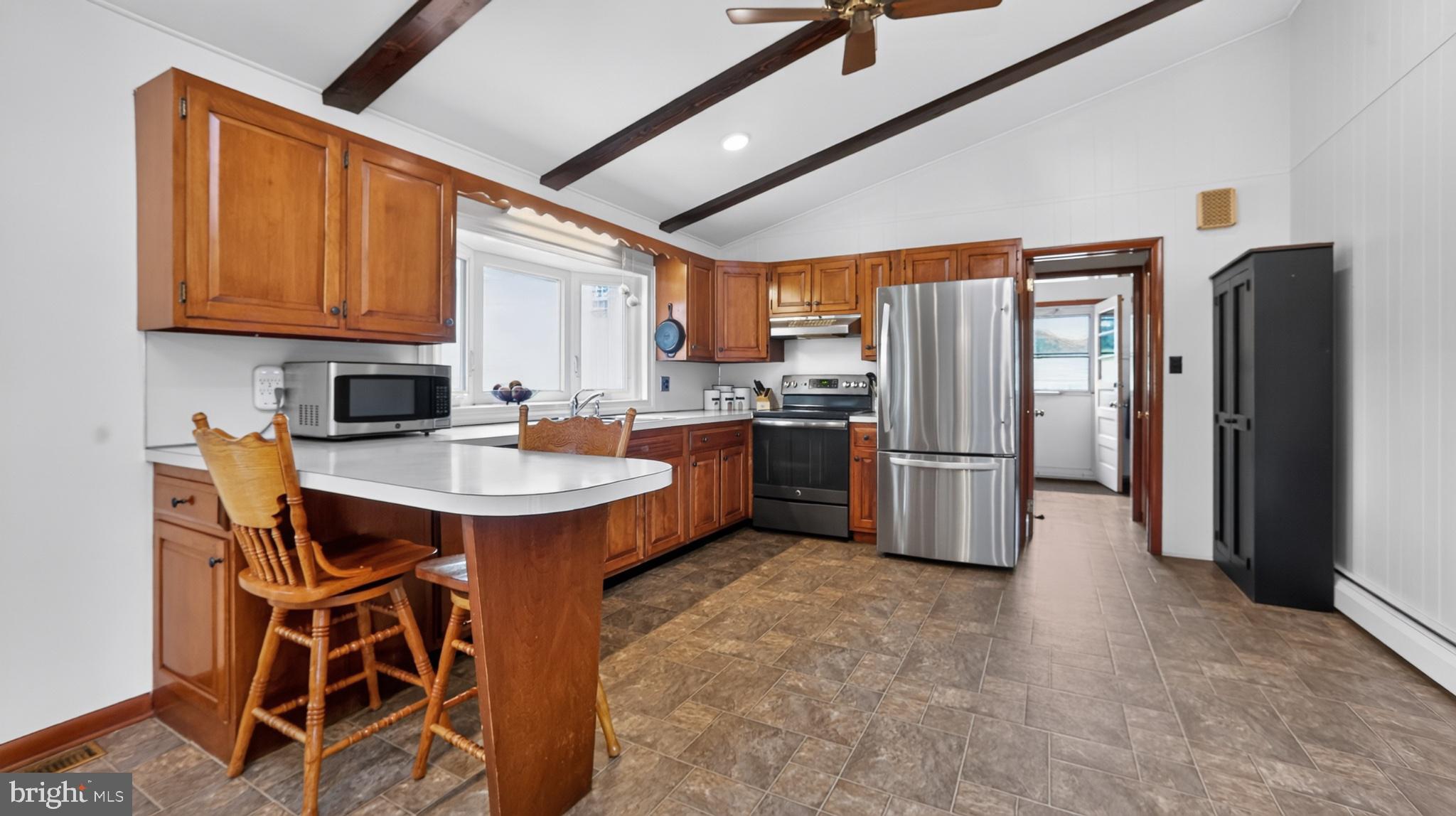 475 South Cocalico Road Denver, PA 17517 - Photo 38 of 91 a kitchen with stainless steel appliances granite countertop a sink a stove a refrigerator and cabinets