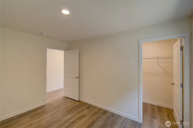 a bathroom with a sink vanity granite and a mirror