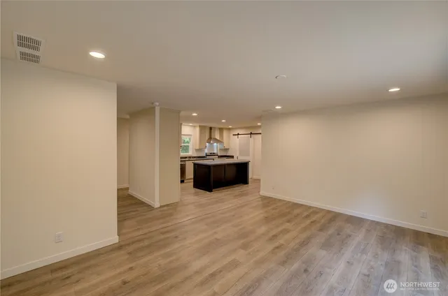 a kitchen with a stove a sink and a refrigerator