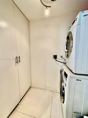 a bathroom with a shower and a mirror