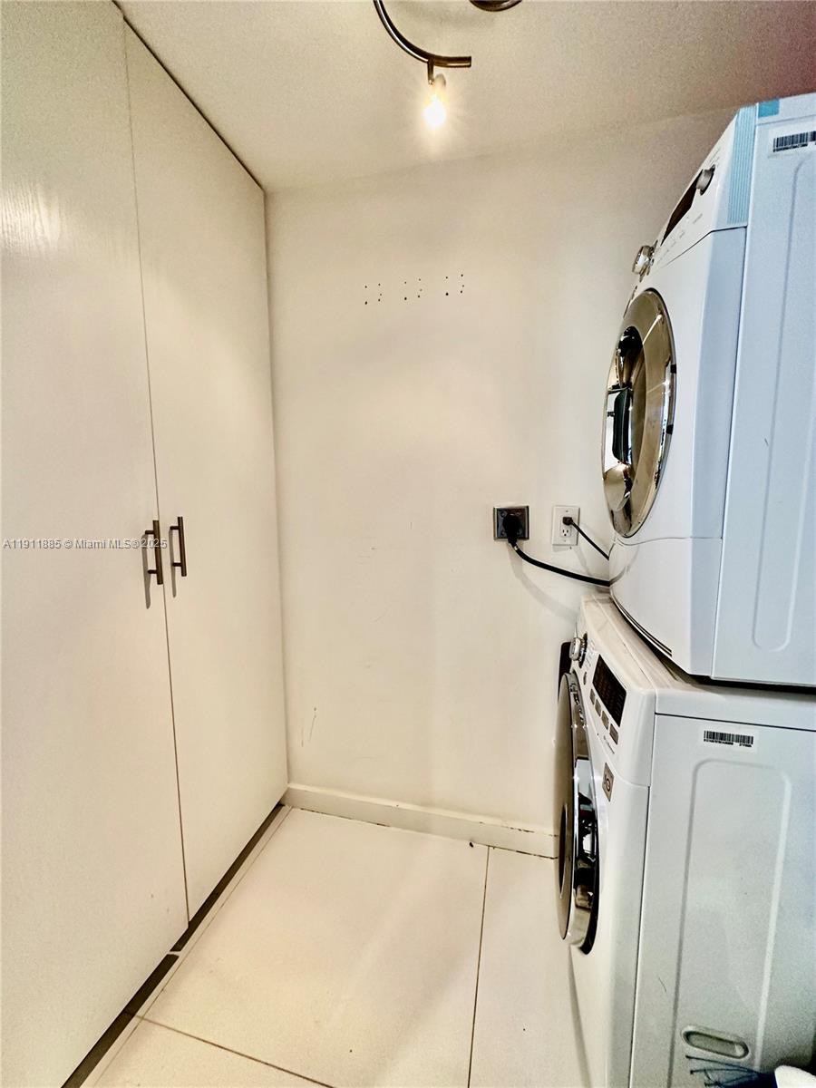 1865 Brickell Avenue, Unit A1209 Miami, FL 33129 - Photo 13 of 26 a bathroom with a shower and a mirror