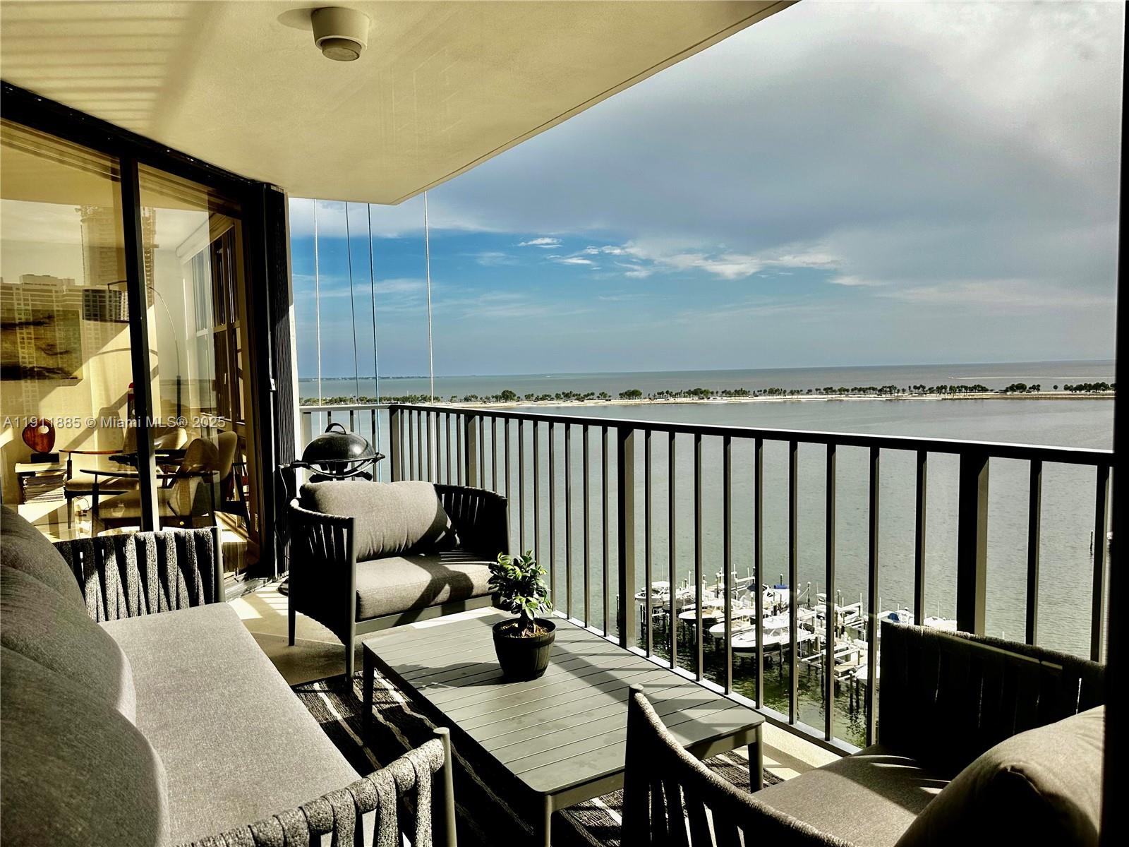 1865 Brickell Avenue, Unit A1209 Miami, FL 33129 - Photo 14 of 26 a view of a balcony dining area