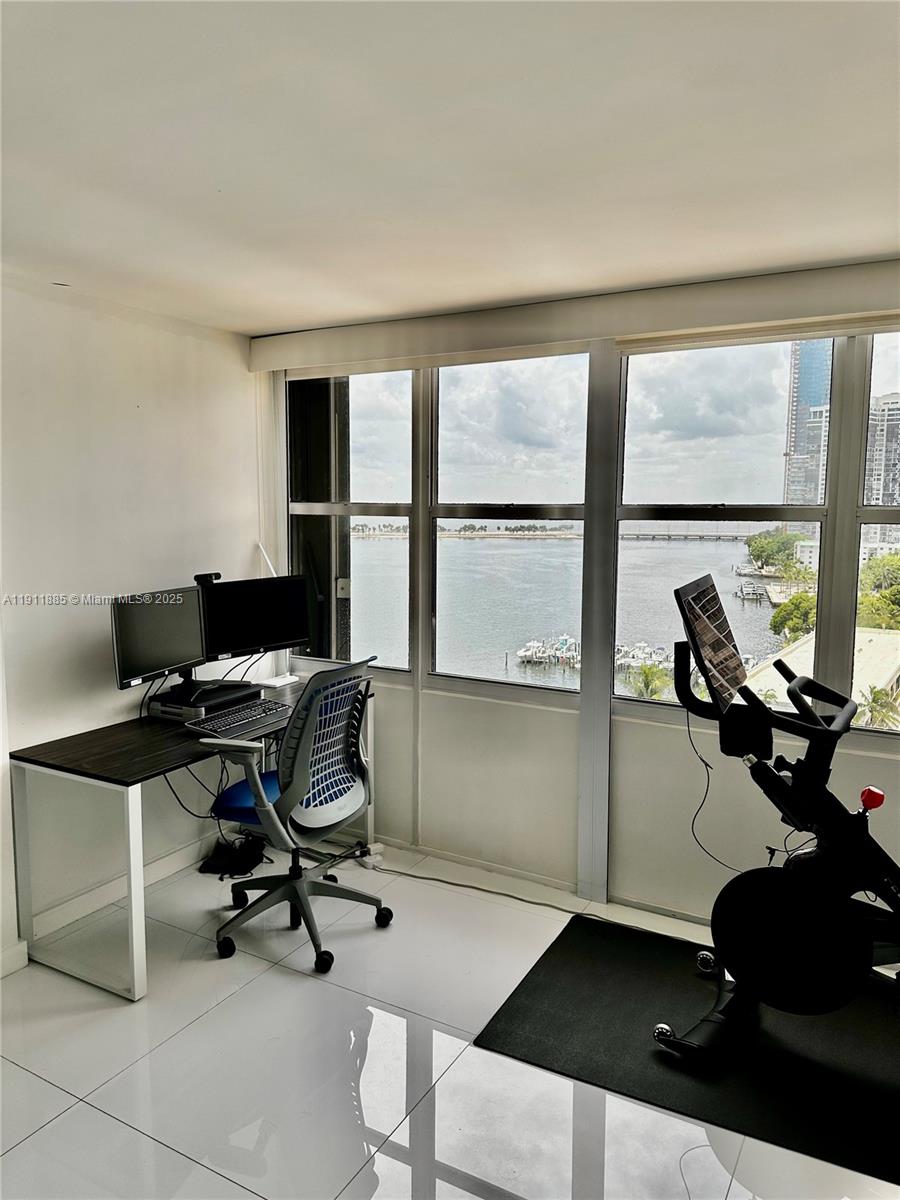 1865 Brickell Avenue, Unit A1209 Miami, FL 33129 - Photo 7 of 26 a view of a workspace with a window