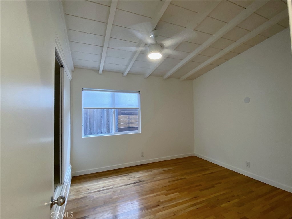 656 Rosecrans Avenue Manhattan Beach, CA 90266 - Photo 15 of 32 an empty room with wooden floor and windows
