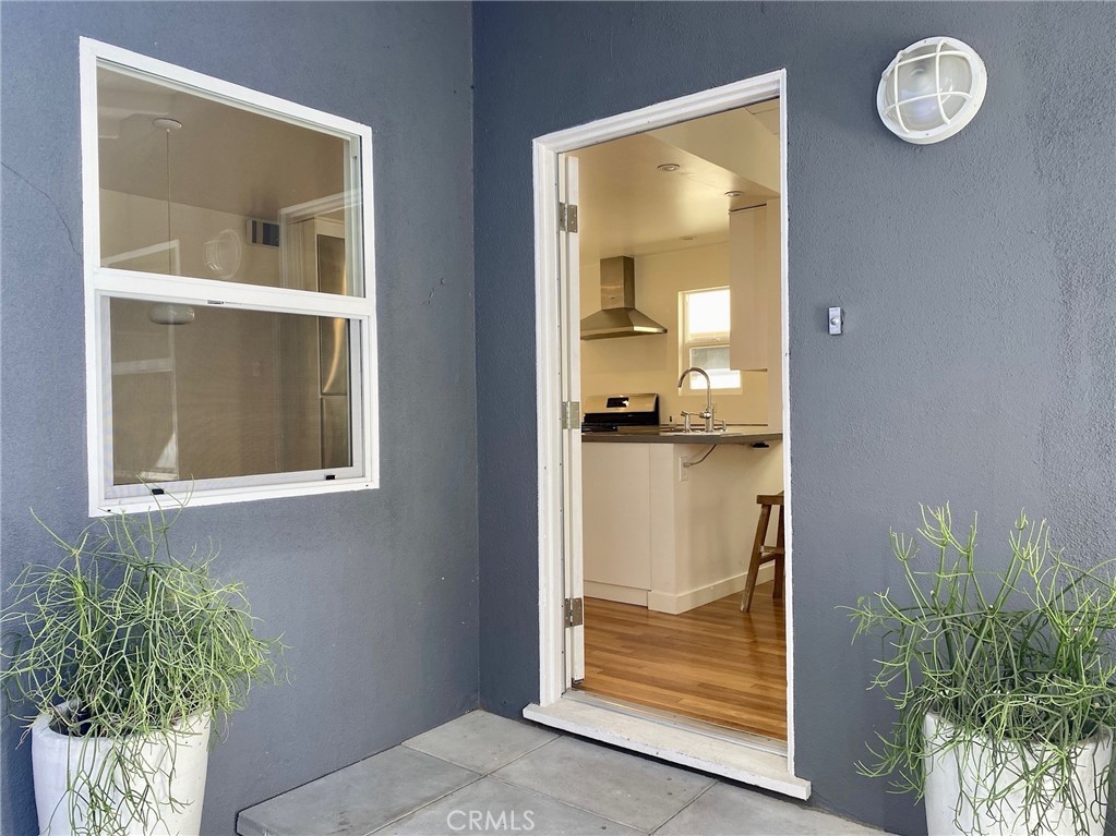 656 Rosecrans Avenue Manhattan Beach, CA 90266 - Photo 6 of 32 a view of a bathroom that has a glass door and a window