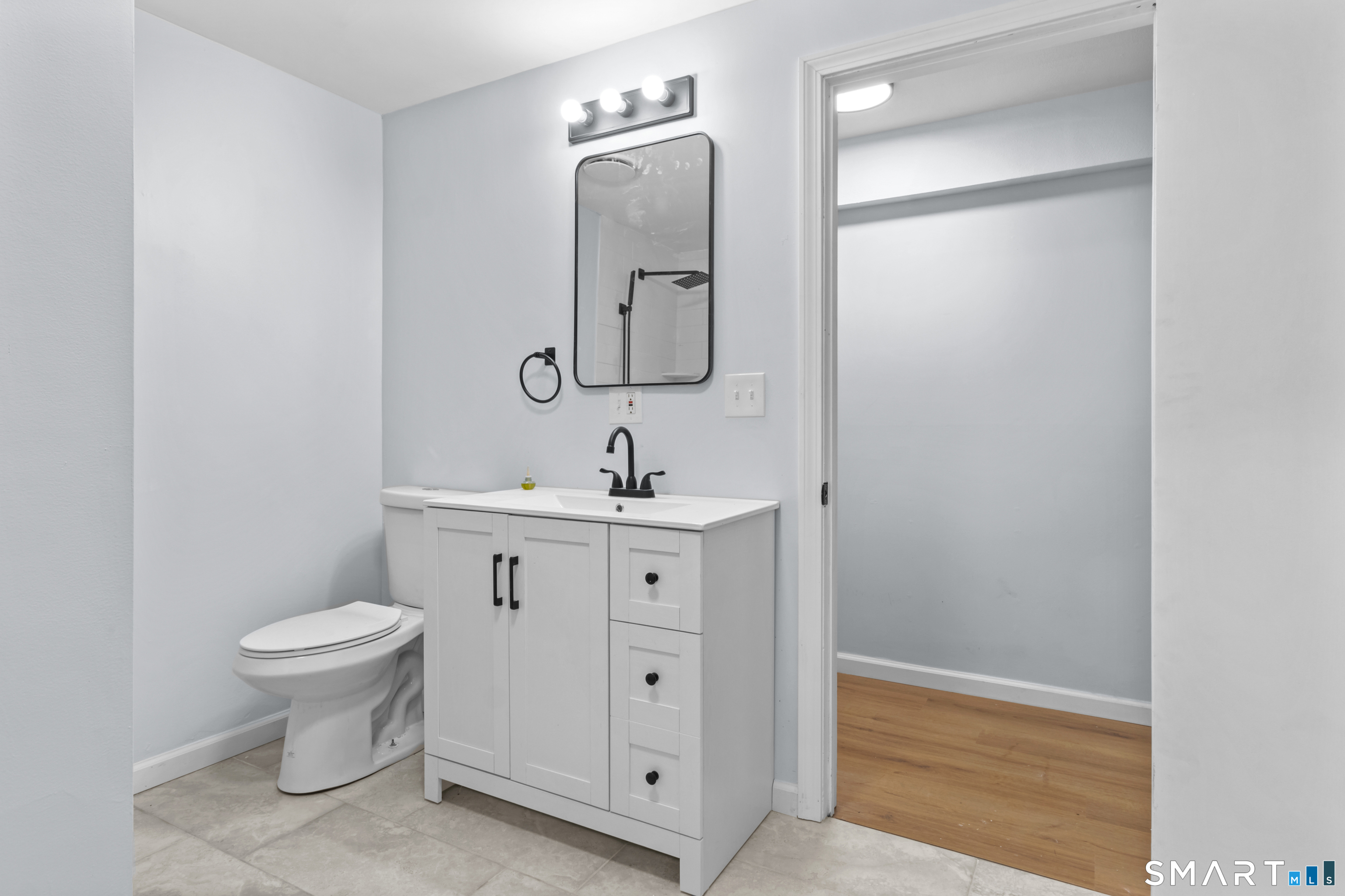 20 Quiet Woods Road East Hampton, CT 06424 - Photo 31 of 40 a bathroom with a toilet sink and mirror