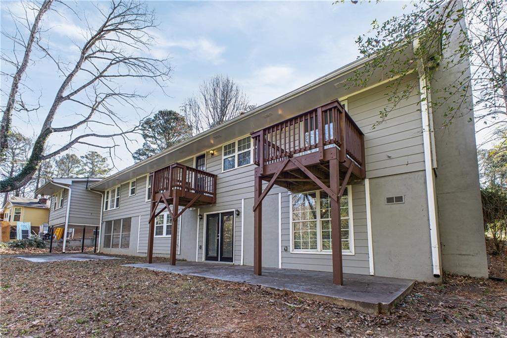 187 Old Timber Road Lawrenceville, GA 30046 - Photo 28 of 32 a front view of a house with a yard
