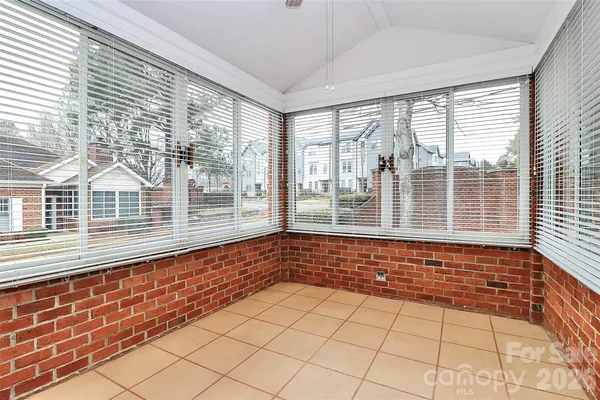 a view of empty room with windows