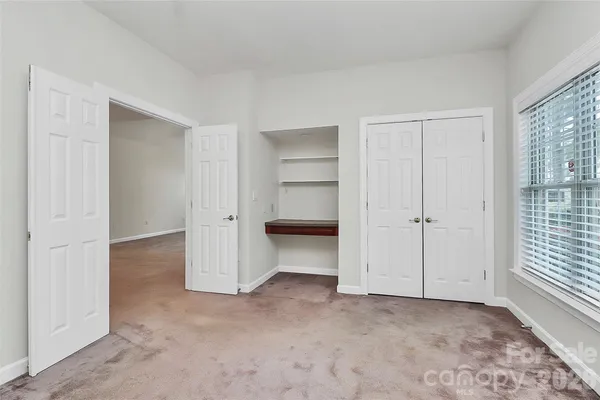 a bathroom with a sink vanity and mirror