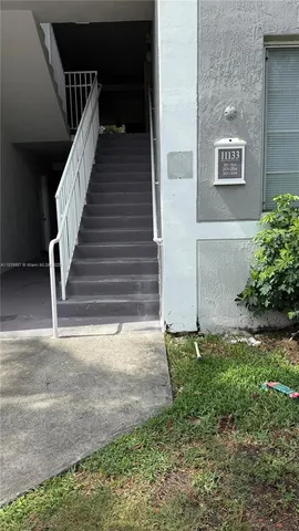 a view of backyard with stairs