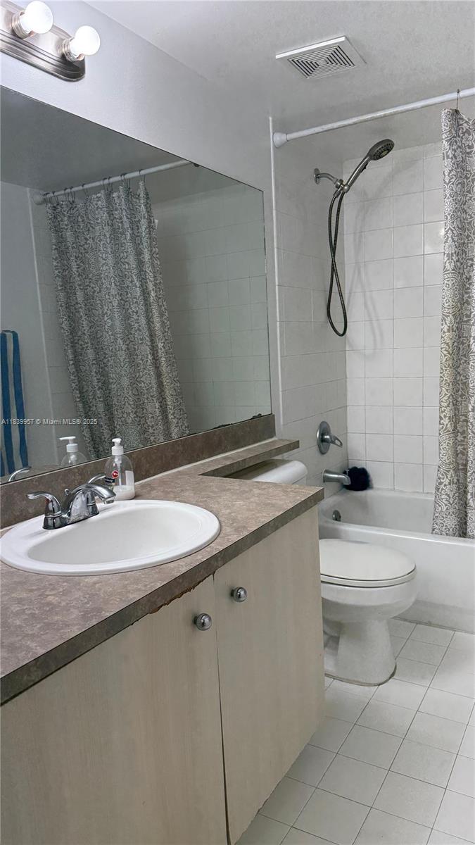 11133 Southwest 8th Street, Unit 102 Pembroke Pines, FL 33025 - Photo 21 of 35 a bathroom with a sink a toilet and shower